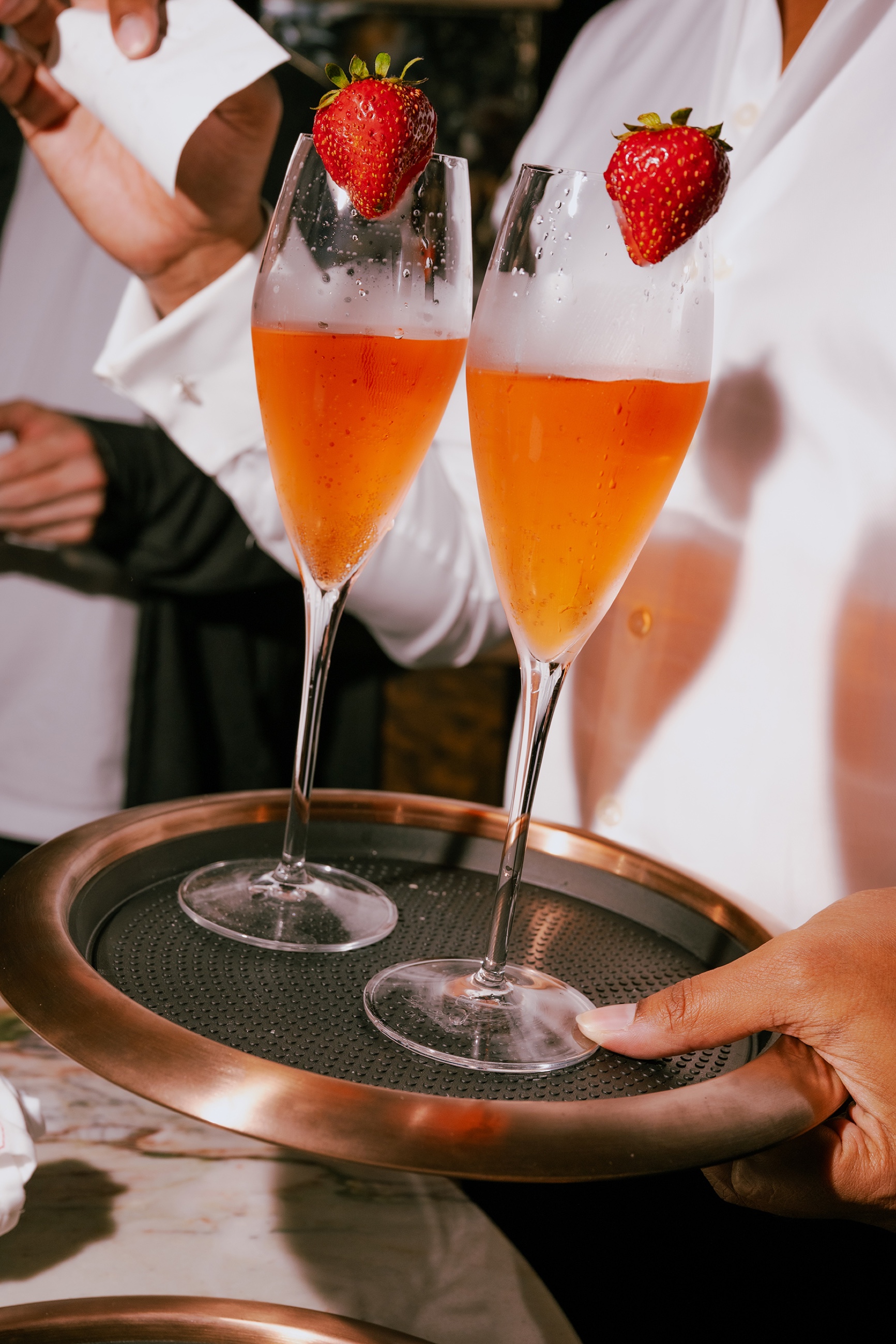 Strawberry champagne cocktails on tray